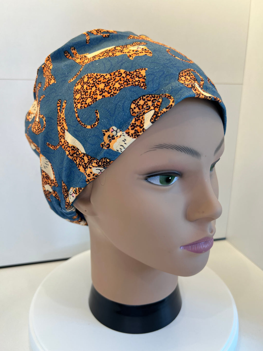 Teal Jumping Leopards Soft Jersey Fabric theatre scrub cap / hat.  Ethically made. Standard and Large size