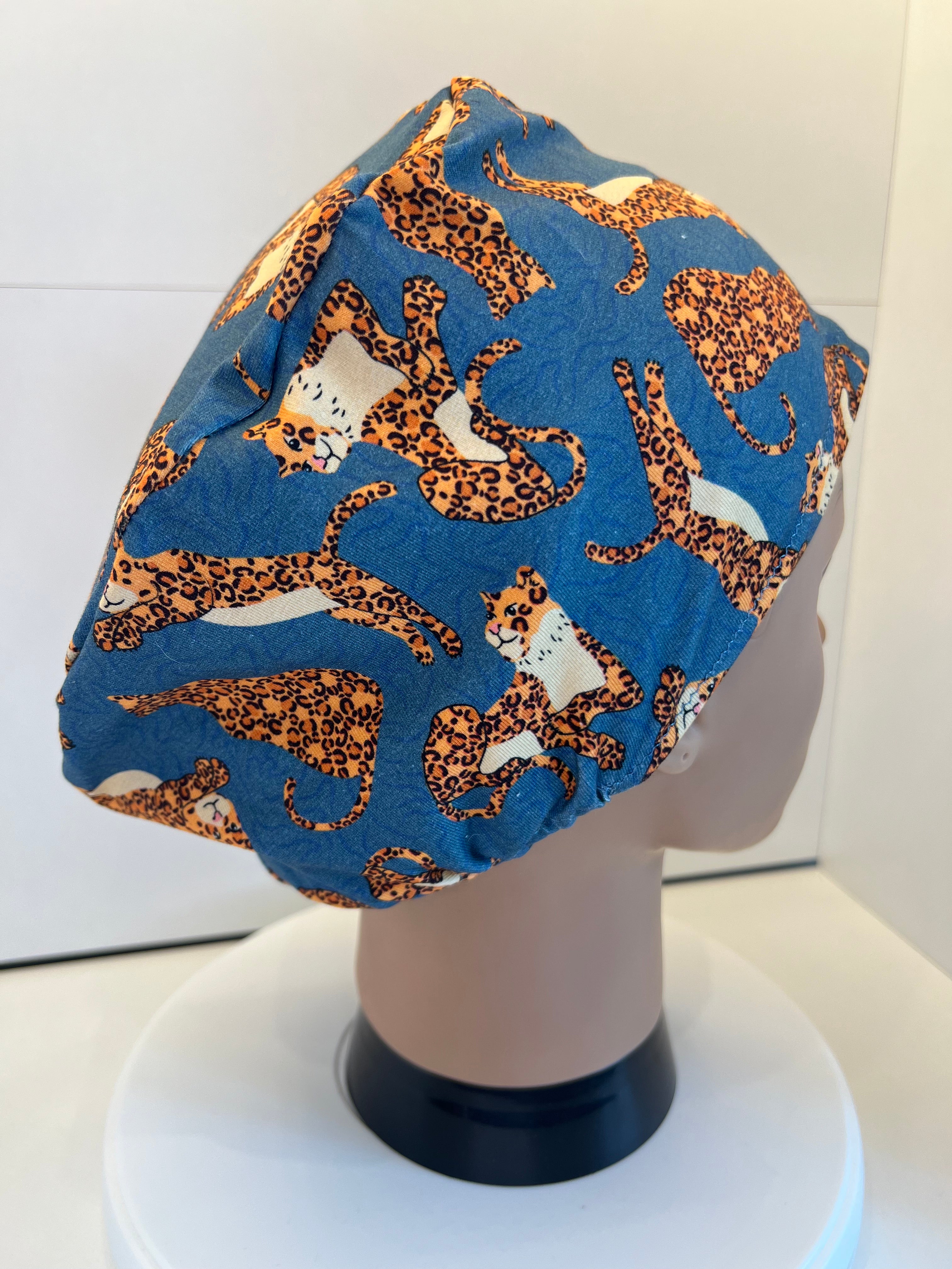 Teal Jumping Leopards Soft Jersey Fabric theatre scrub cap / hat.  Ethically made. Standard and Large size