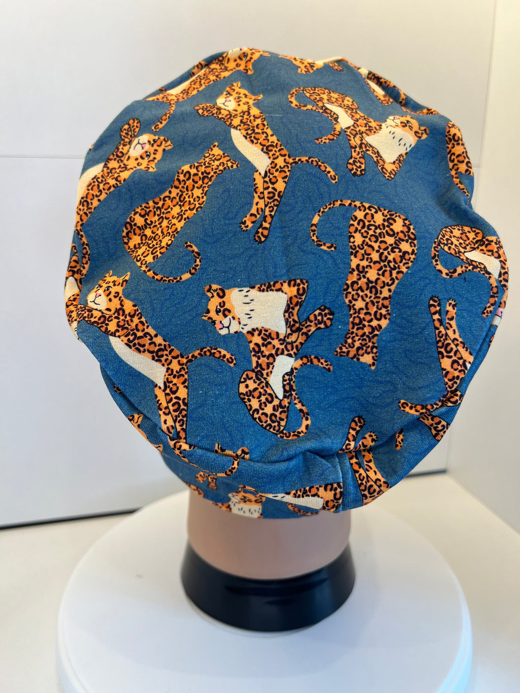 Teal Jumping Leopards Soft Jersey Fabric theatre scrub cap / hat.  Ethically made. Standard and Large size