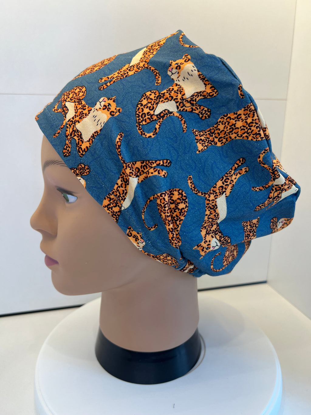 Teal Jumping Leopards Soft Jersey Fabric theatre scrub cap / hat.  Ethically made. Standard and Large size