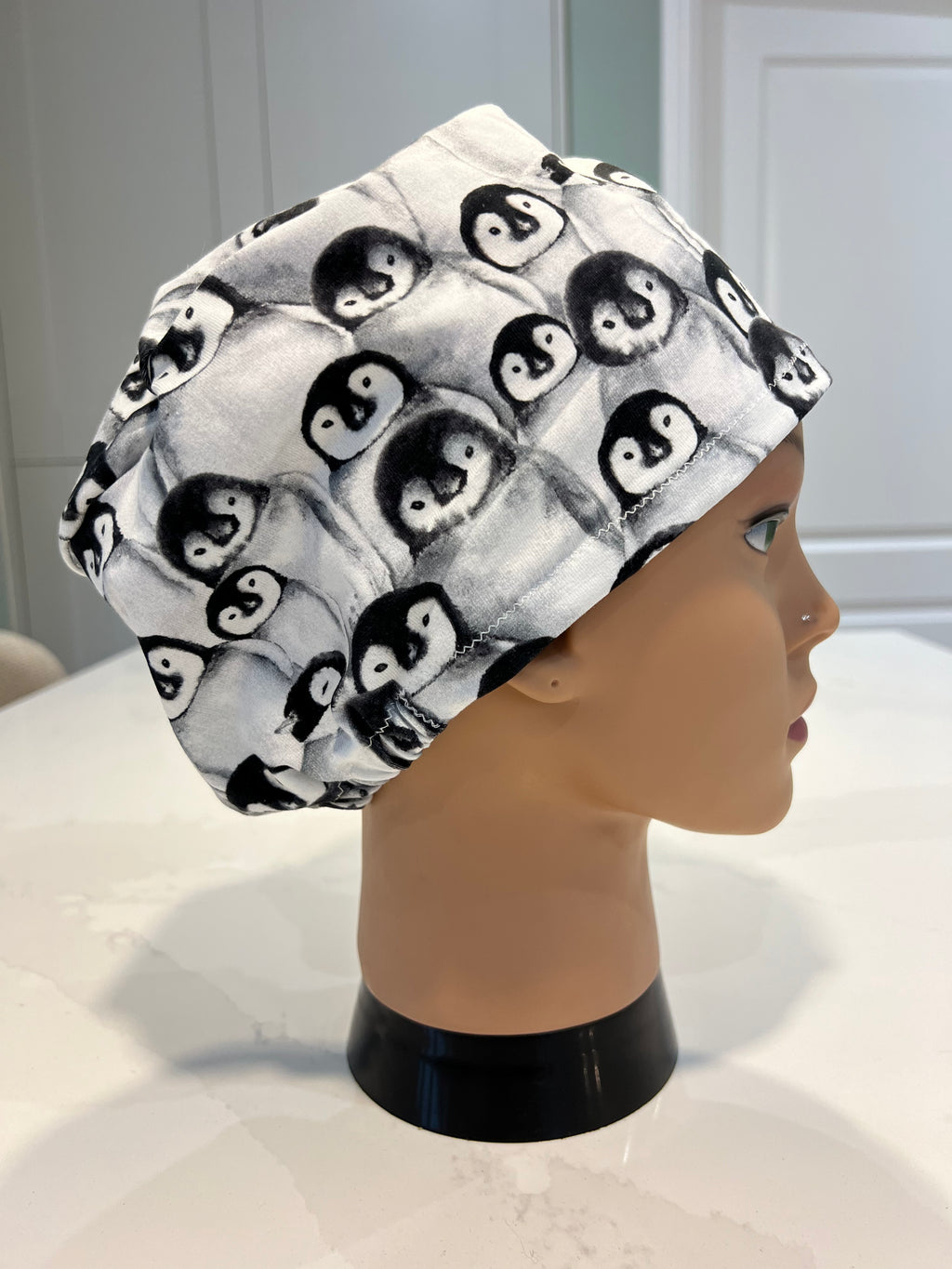 Huddled Penguins Jersey Cotton theatre scrub hat/cap. Winter/ Christmas/ Xmas themed.