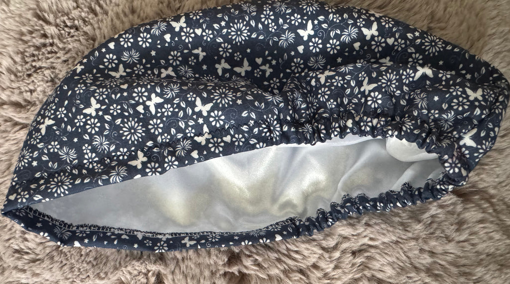 Navy and White Flower and Butterfly design Satin-lined fabric theatre scrub cap / hat.  Ethically made.