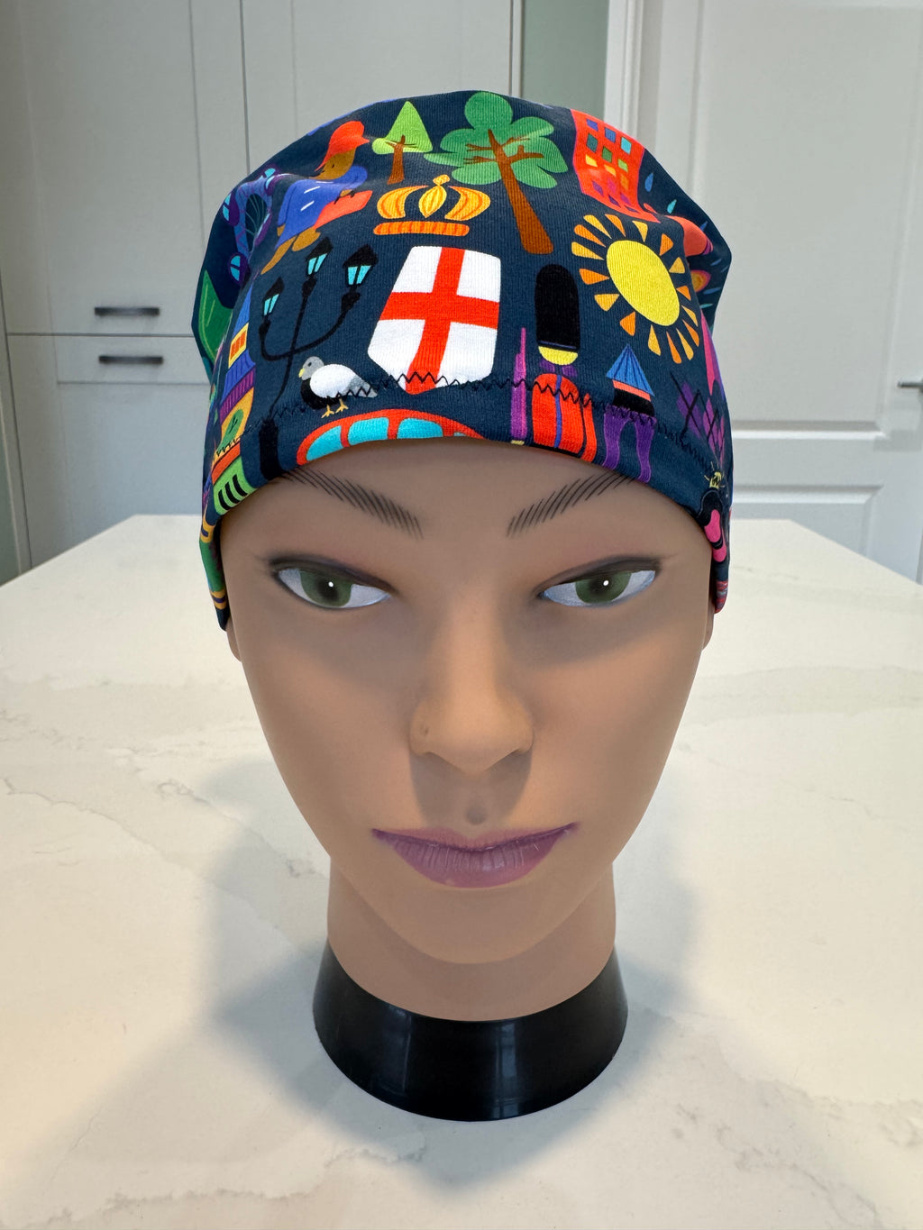 London themed Navy Soft Jersey Fabric theatre scrub cap / hat.  Ethically made. Standard and Large size