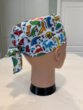 Fun Dinosaurs Cotton Fabric tie-back theatre scrub cap / hat.  Ethically made