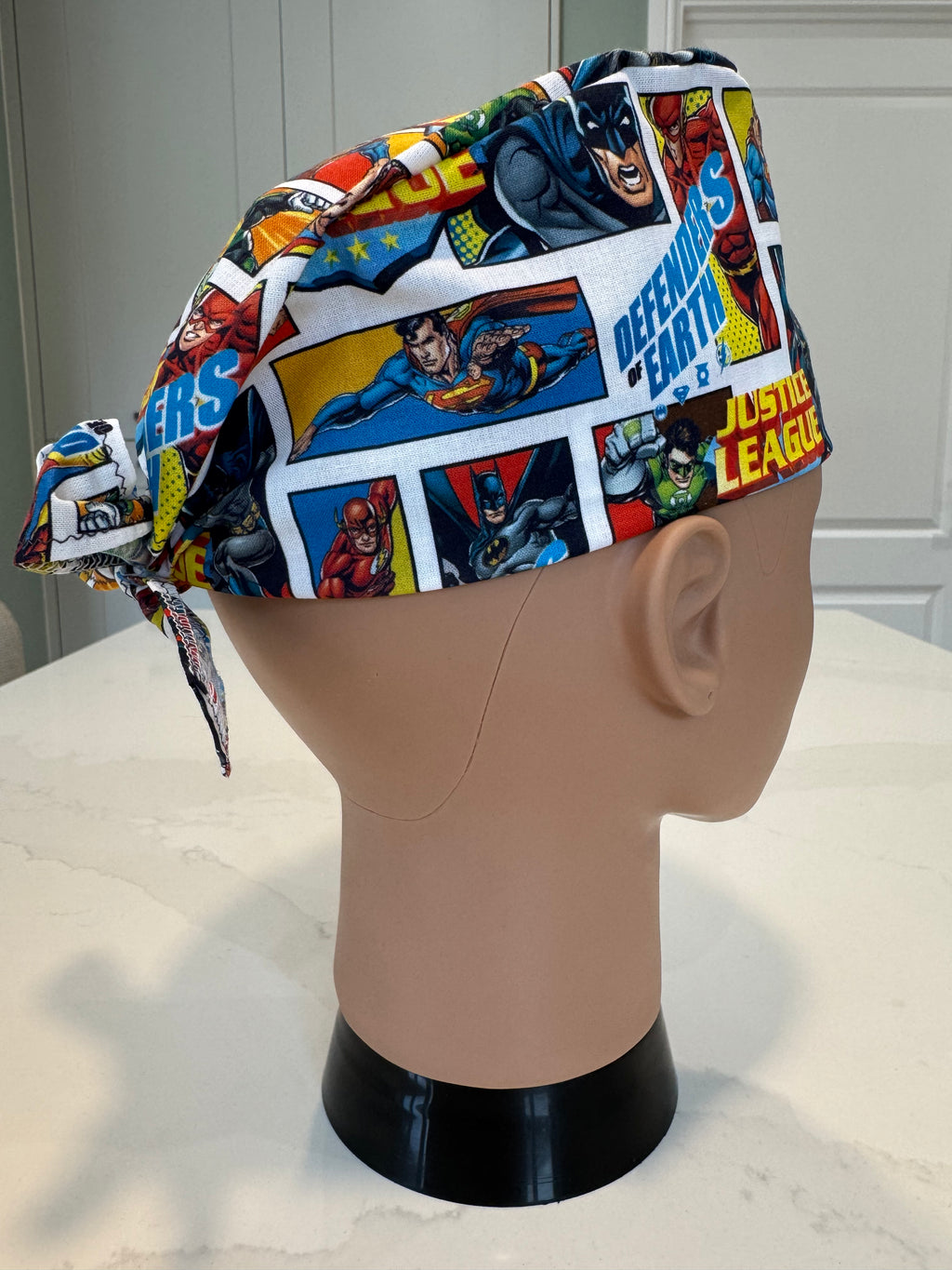 Justice League Superhero design Cotton Fabric tie-back theatre scrub cap / hat.  Ethically made.