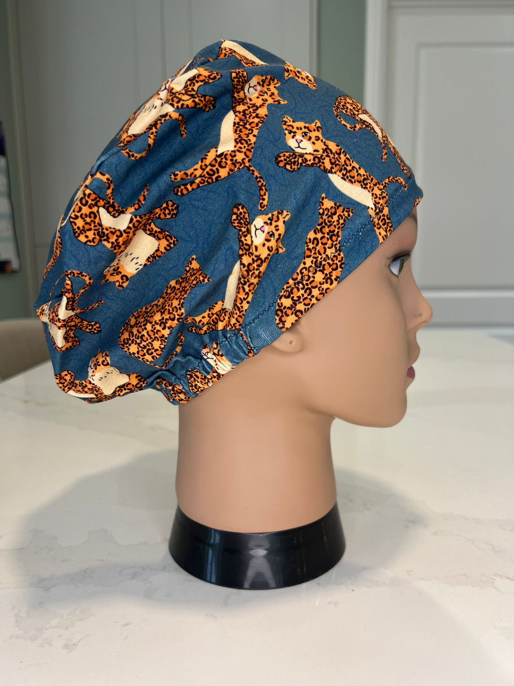 Teal Jumping Leopards Soft Jersey Fabric theatre scrub cap / hat.  Ethically made. Standard and Large size