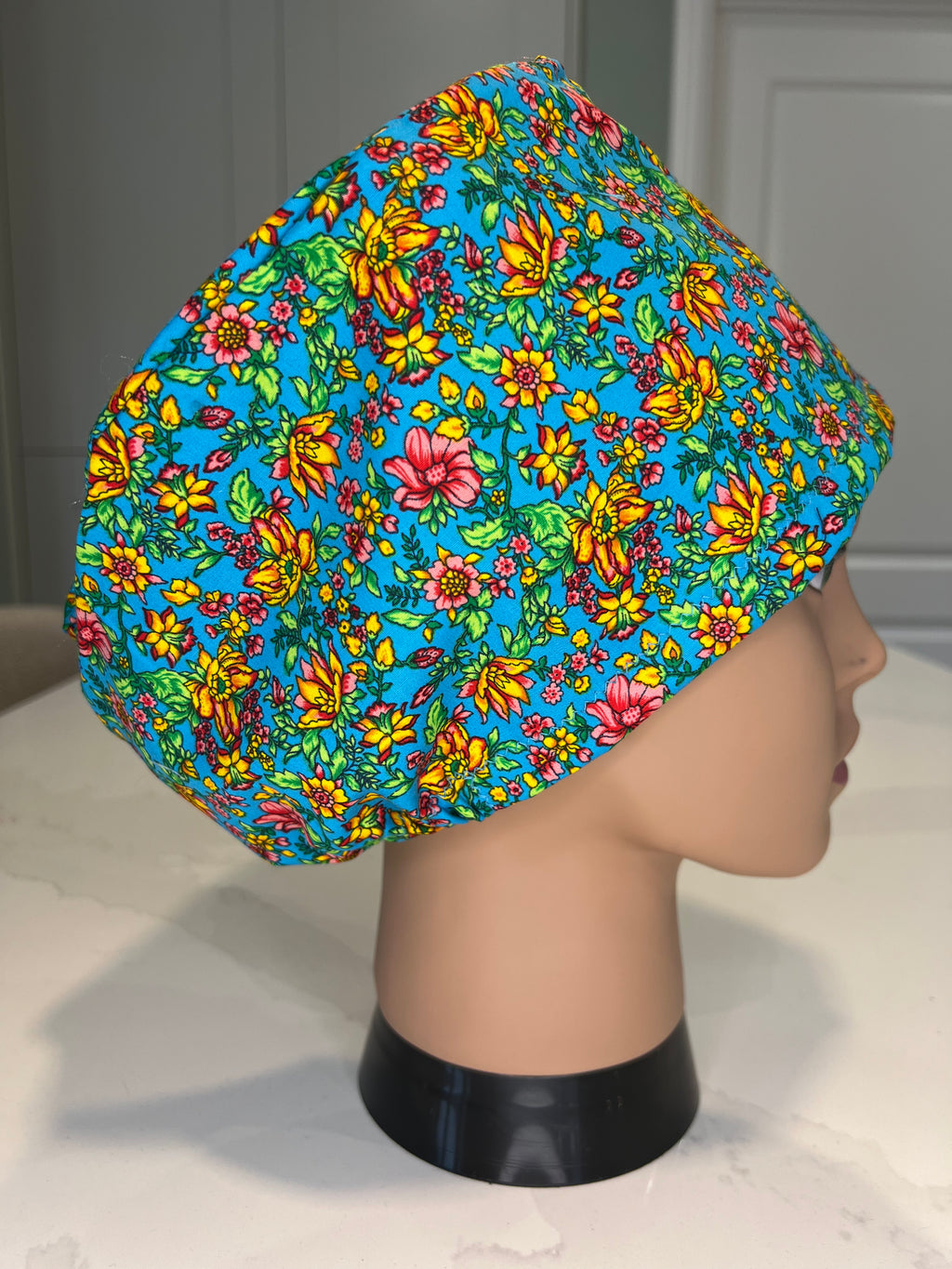 Vibrant Turquoise Floral design Satin-lined fabric theatre scrub cap / hat.  Ethically made.