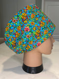 Vibrant Turquoise Floral design 100% Cotton fabric theatre scrub cap / hat.  Ethically made.