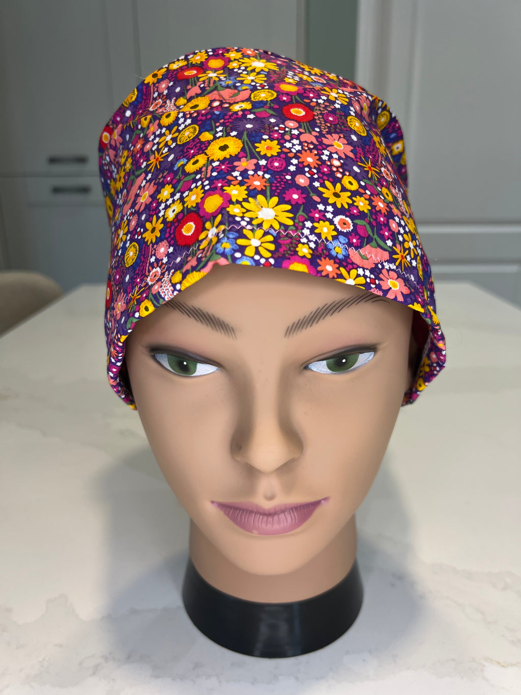 Purple vibrant ditsy flower patterned Satin-lined fabric theatre scrub cap / hat.  Ethically made.