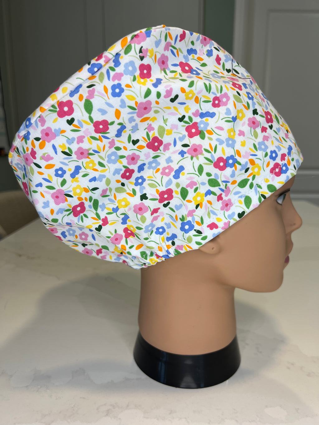 Pink and Blue Floral design Satin-lined fabric theatre scrub cap / hat.  Ethically made.