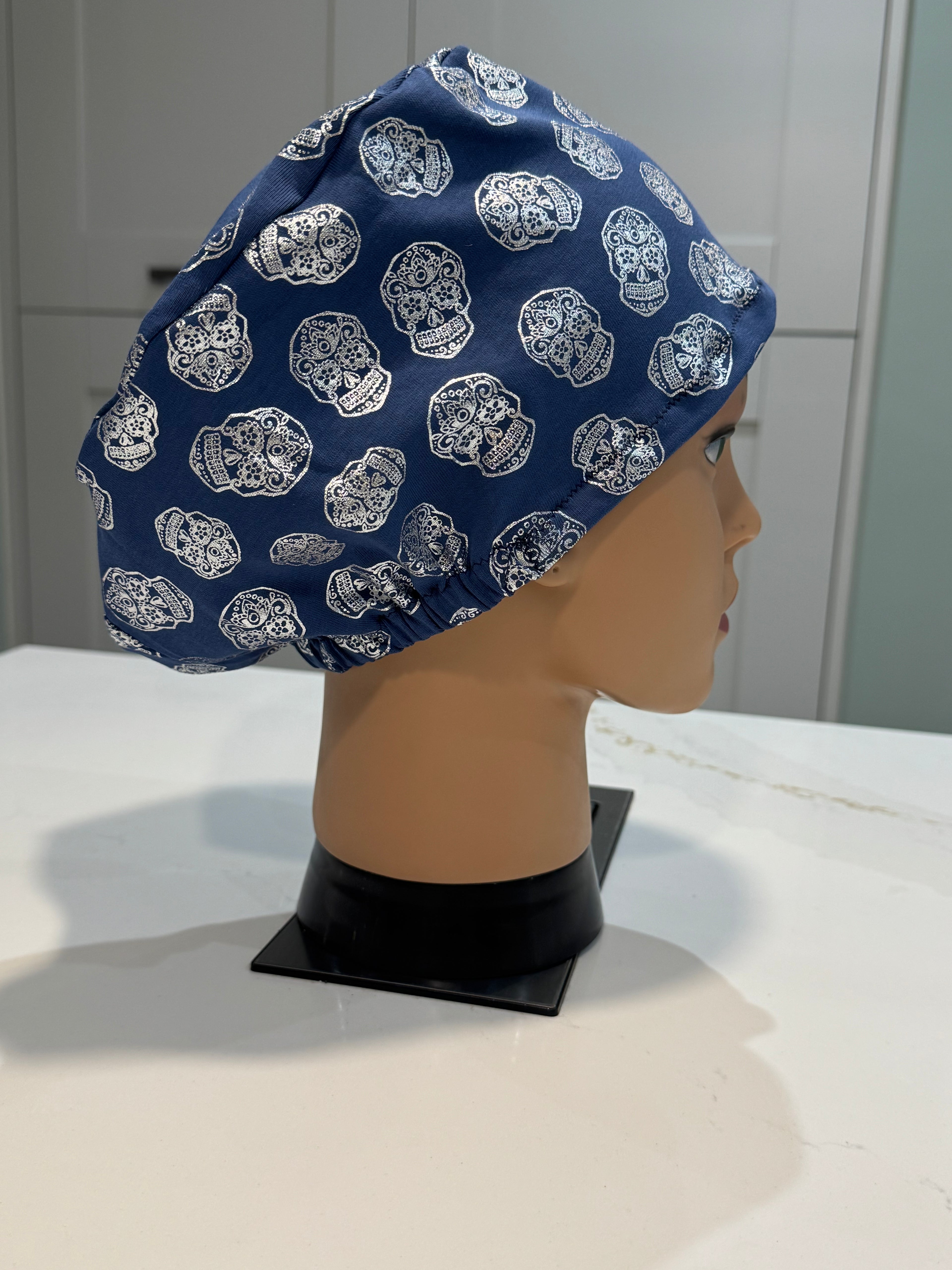 Blue Foil Skulls design Soft Jersey Fabric theatre scrub cap / hat.  Ethically made.
