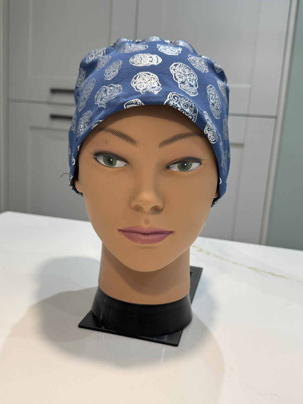 Blue Foil Skulls design Soft Jersey Fabric theatre scrub cap / hat.  Ethically made.