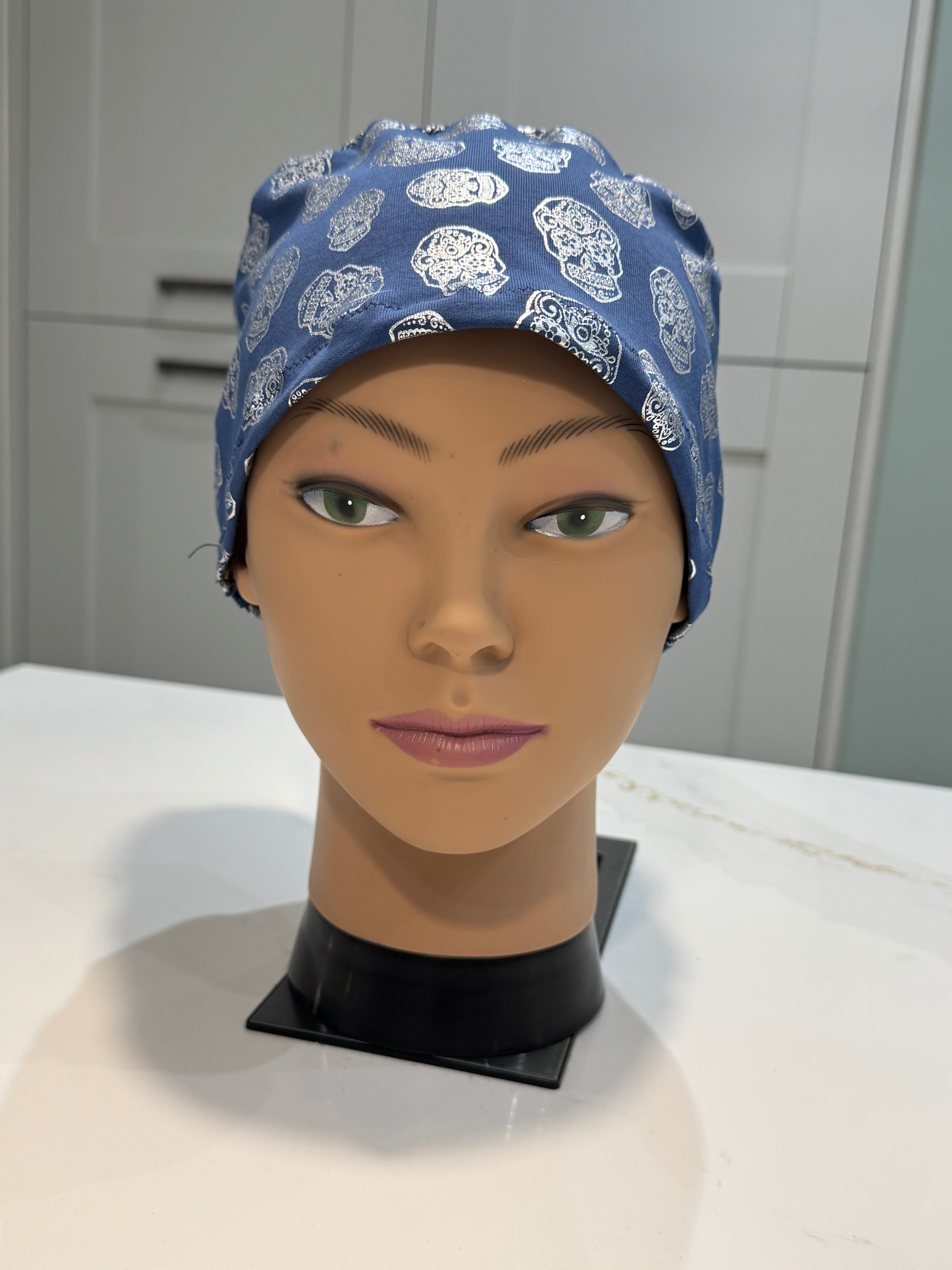 Blue Foil Skulls design Soft Jersey Fabric theatre scrub cap / hat.  Ethically made.