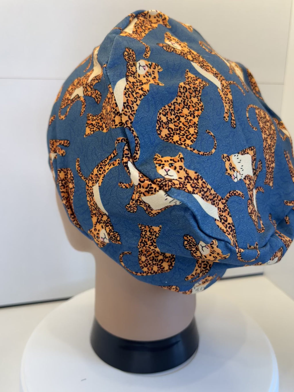 Teal Jumping Leopards Soft Jersey Fabric theatre scrub cap / hat.  Ethically made. Standard and Large size